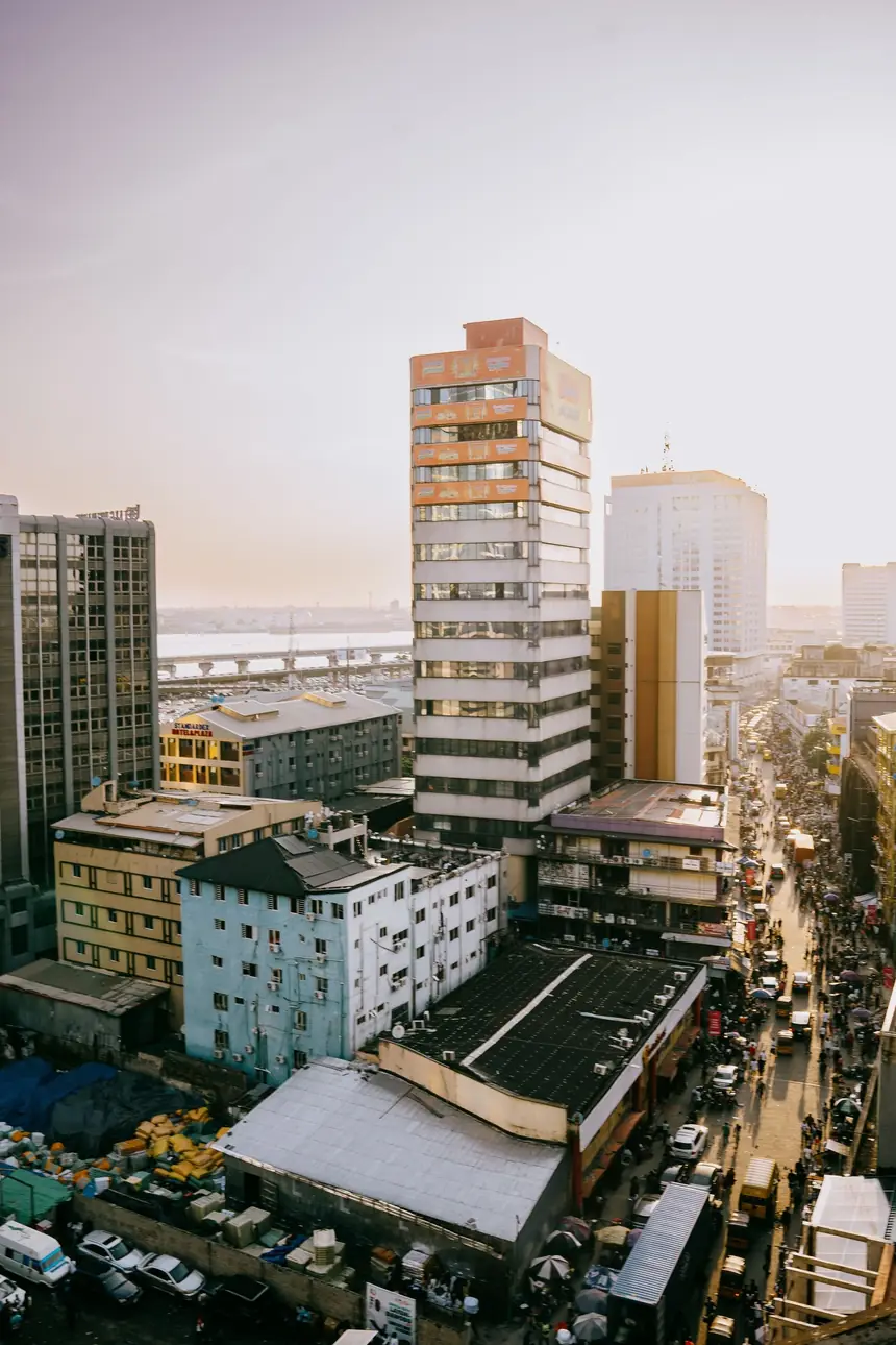 Aerial view of central Lagos at dusk, a real photograph rather than a screenshot from the game